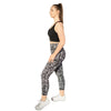 Floral black and white 7/8th leggings from Milbel Active - side view of girl modelling black sports bra and floral black and white leggings