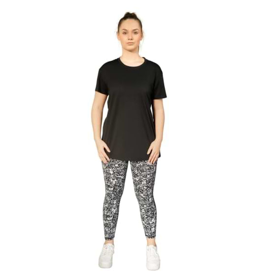 Black open back tee from Milbel Active - front view of girl modelling black tee top and floral leggings