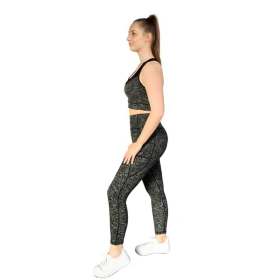 Floral black and olive sports bra from Milbel Active - side view of girl modelling floral black and olive sports bra and leggings