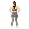 Floral black and white sports bra from Milbel Active - back view of girl modelling floral black and white sports bra and leggings