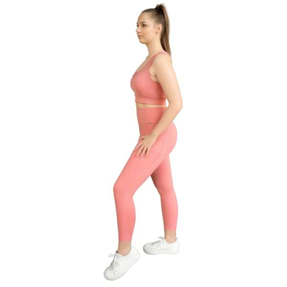Pink sports bra from Milbel Active - side view of girl modelling pink sports bra and leggings